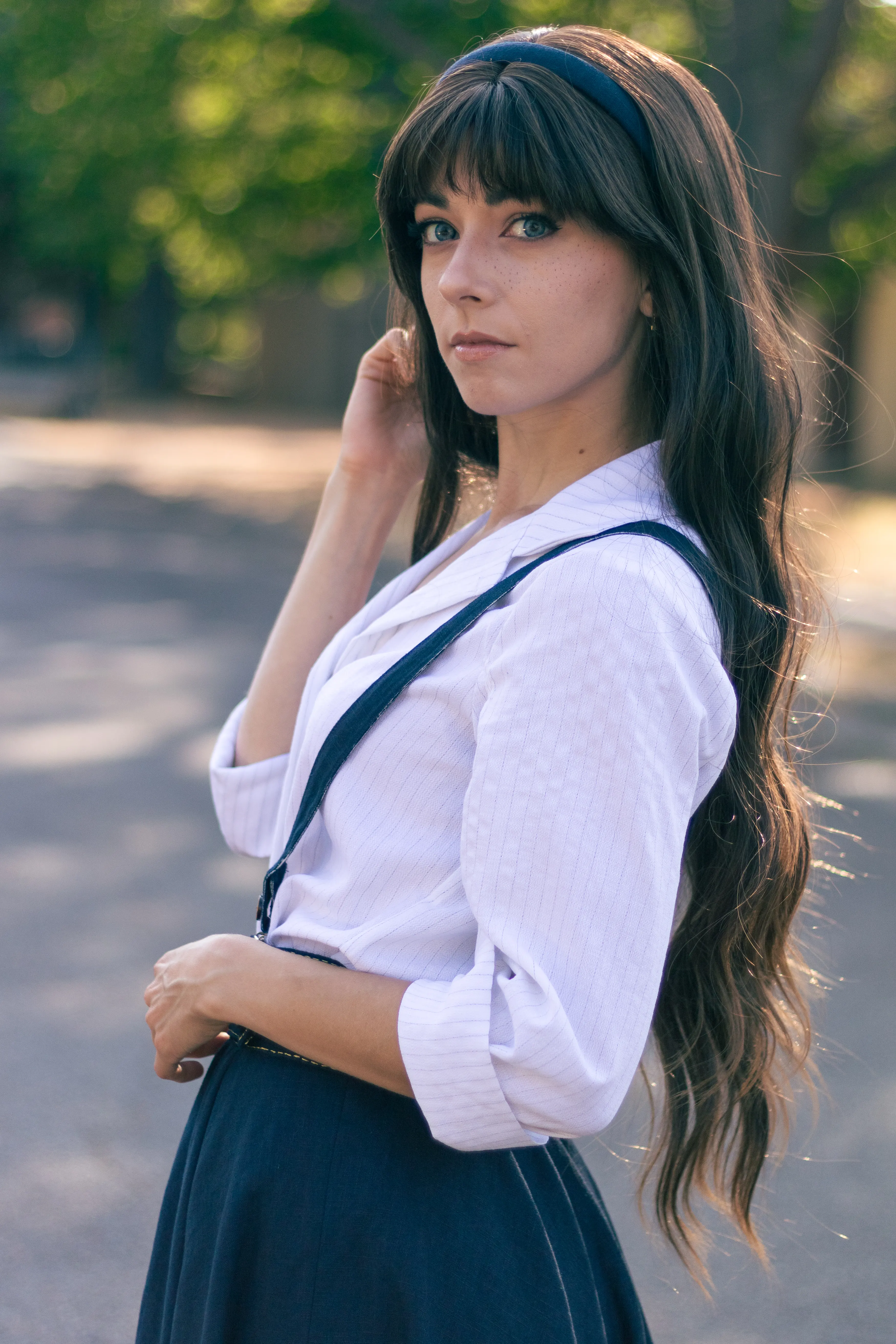 Clea Dessendre from Clair Obscur: Expedition 33, hand in her hair, looking back over her shoulder, Ryuu Seika cosplay