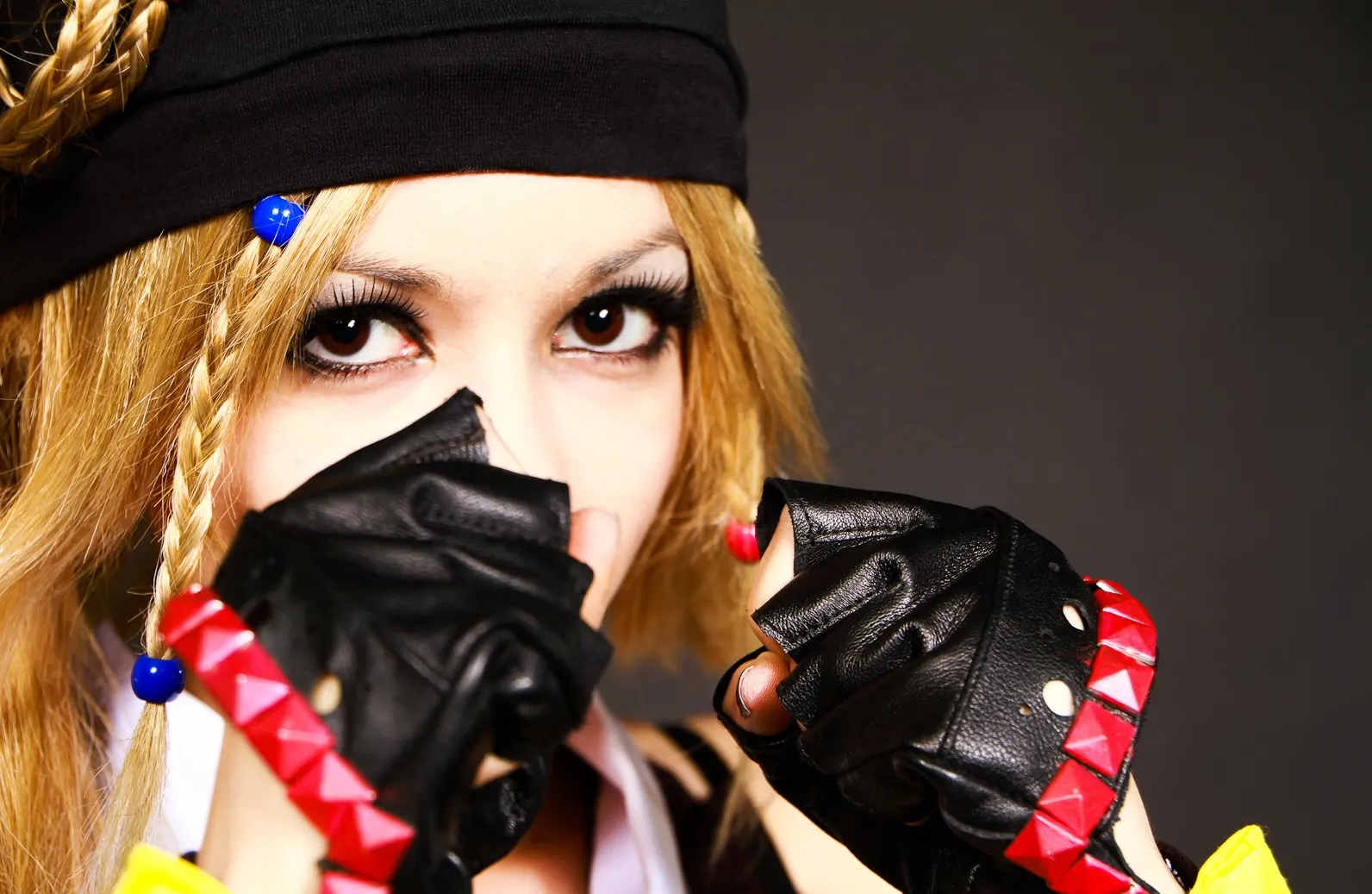 Rikku Ninja from Final Fantasy X-2, close-up of the studded leather gloves crossed in front of the face, cosplay by Ryuu Seika 2012